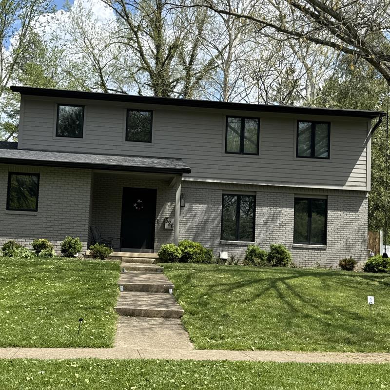 Asphalt shingle roof inspection at two-story house