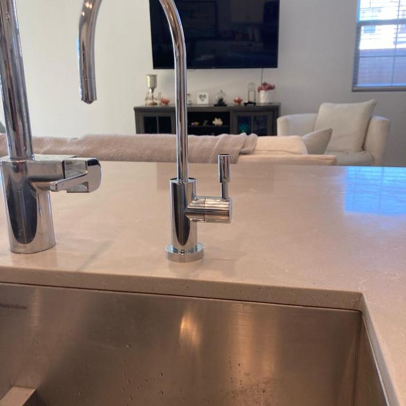 Chrome RO faucet installed on kitchen countertop