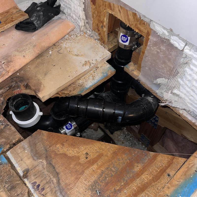 P-trap drainage pipe installation under subfloor