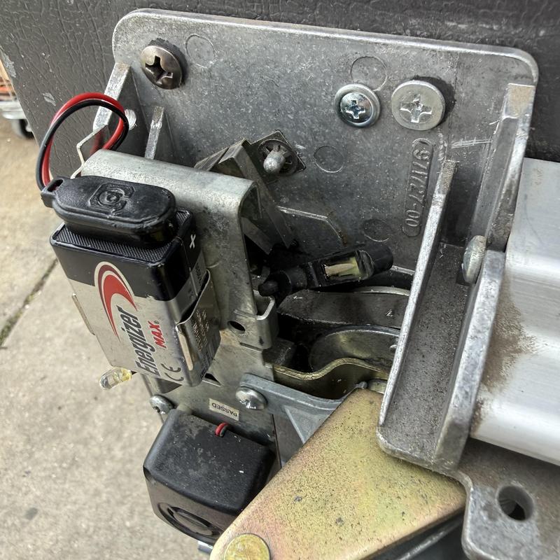 Exit device with key cylinder and battery in lock assembly