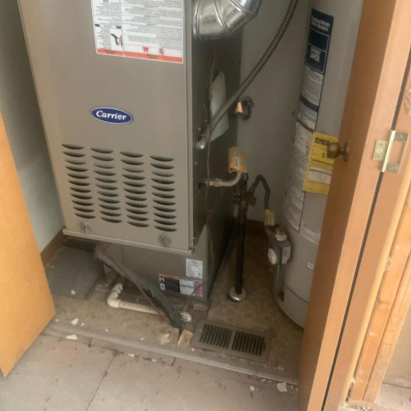 Carrier HVAC furnace and water heater in utility closet