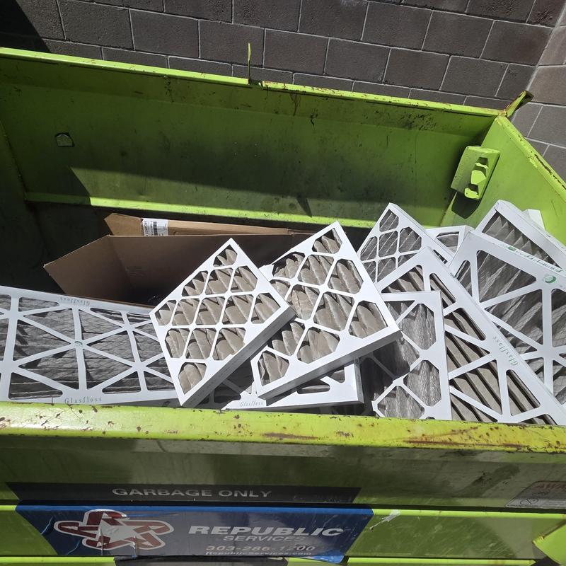 HVAC air filters discarded in dumpster at vet clinic