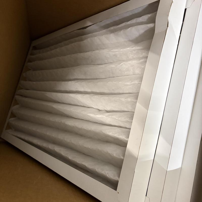 HVAC air filters stacked inside box