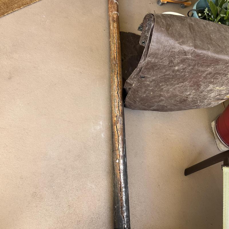 Cast-iron sewer stack pipe with visible crack Cast-iron sewer stack pipe with visible crack