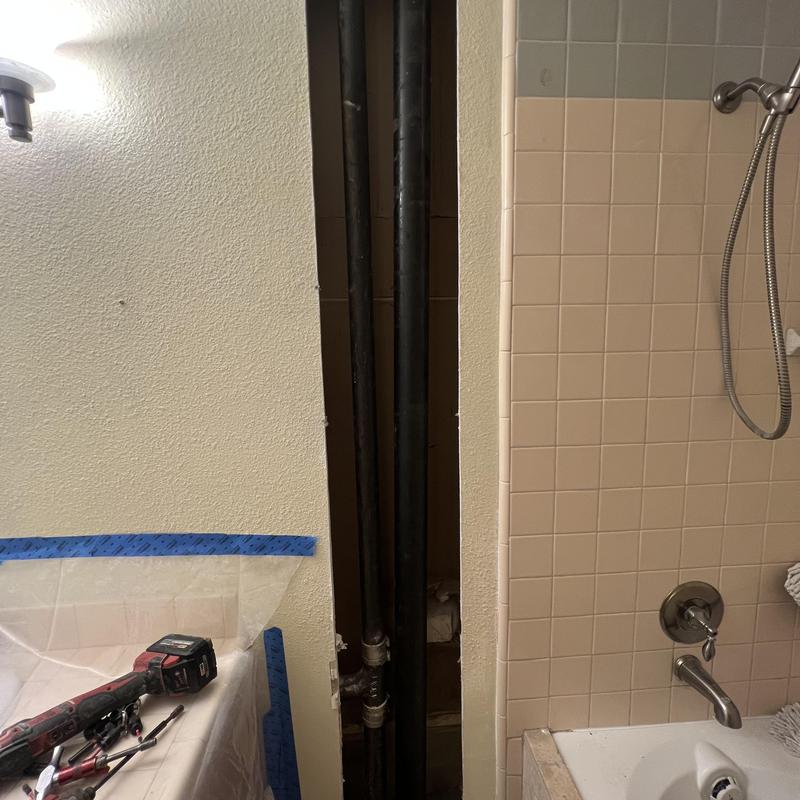 3-inch cast-iron sewer stack with drywall removed 3-inch cast-iron sewer stack with drywall removed