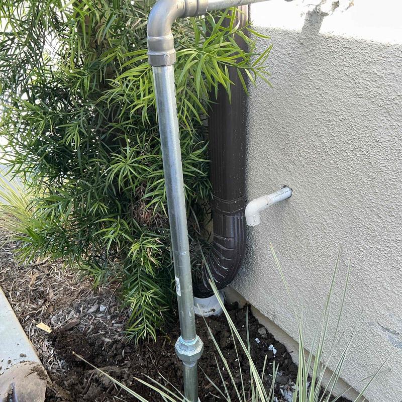 Galvanized pipe with union and elbow outside home