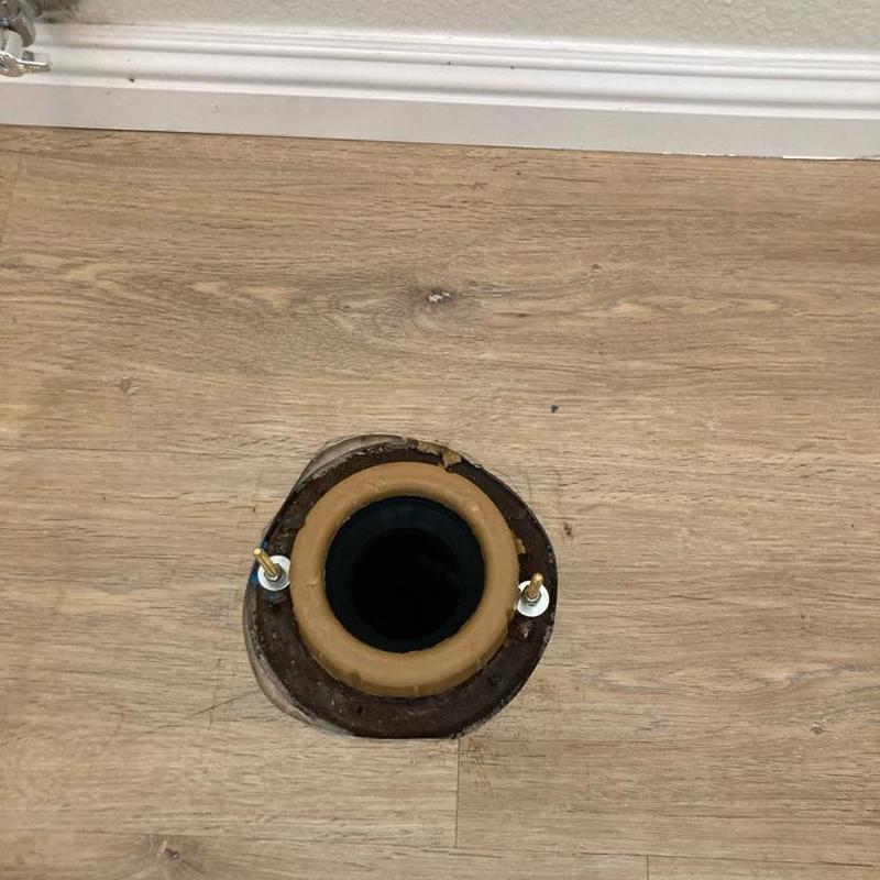 Toilet flange and wax ring installation on wood floor