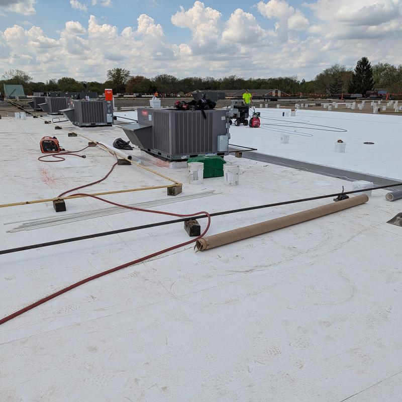 TPO single ply roofing membrane installation on flat roof