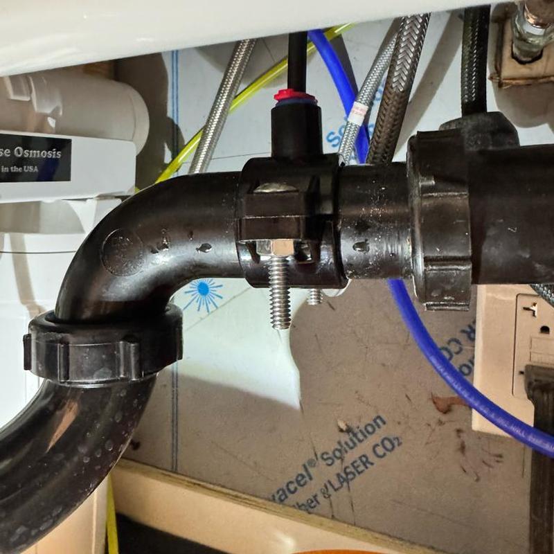 RO drain saddle with replacement gasket under sink
