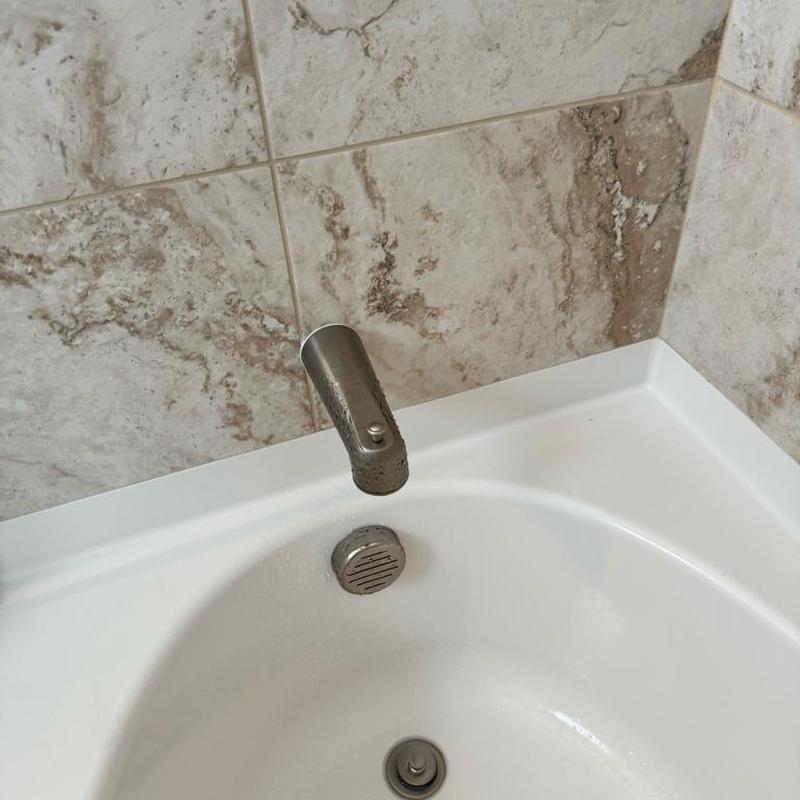 Brushed nickel slip style tub spout with silicone seal