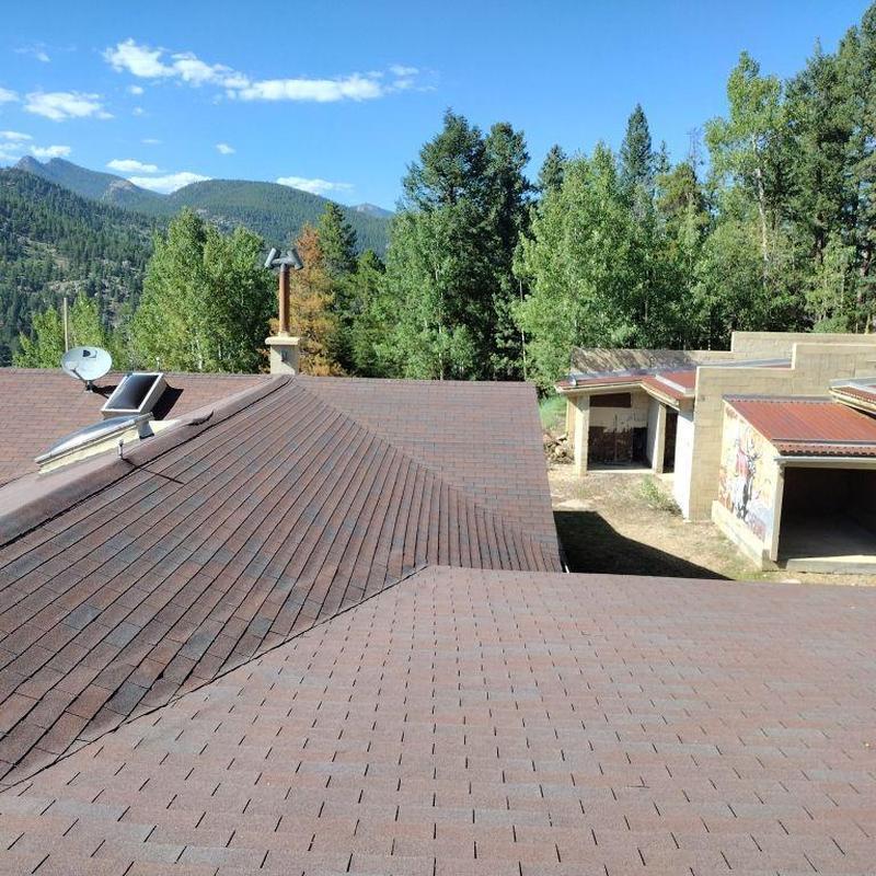 Shingle roof with hail damage on multiple slopes Shingle roof with hail damage on multiple slopes