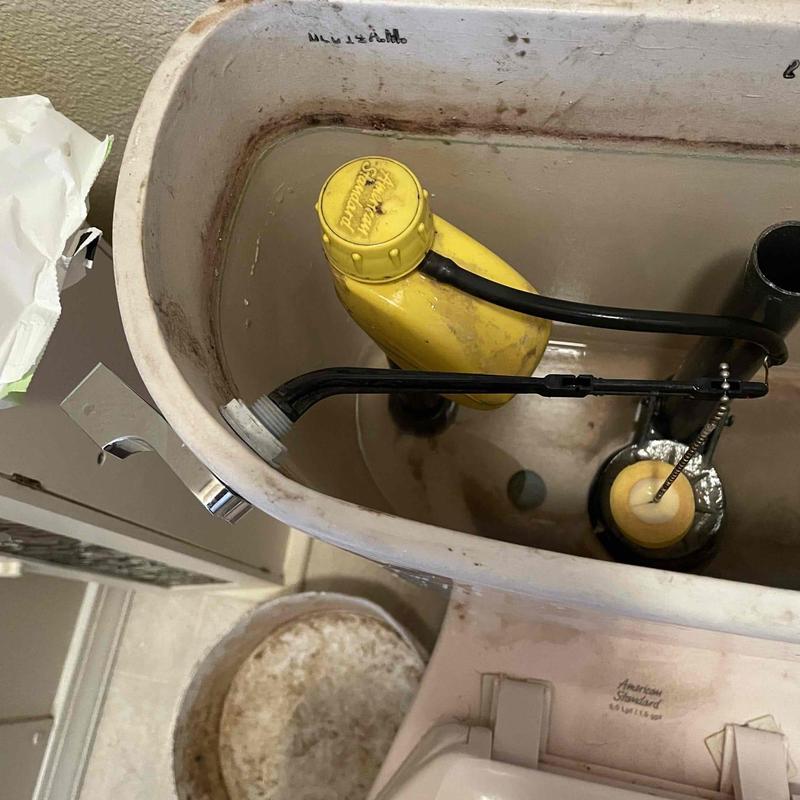 Toilet fill valve inside tank with worn seal