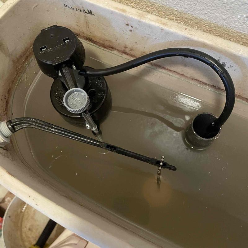 Toilet fill valve and float mechanism inside tank