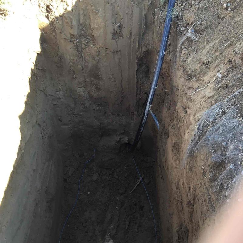 Water service line dig and directional boring hole