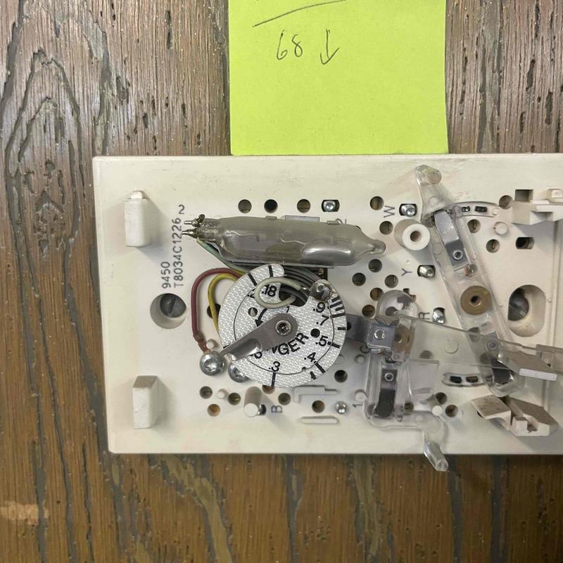 Electric furnace programmable thermostat internal components exposed