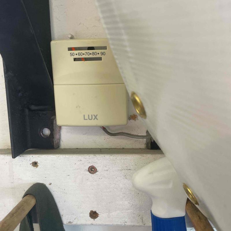 Electric furnace wall thermostat installed in attic