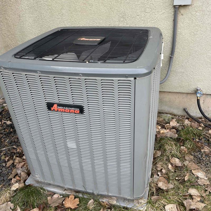 Amana air conditioner unit outside home