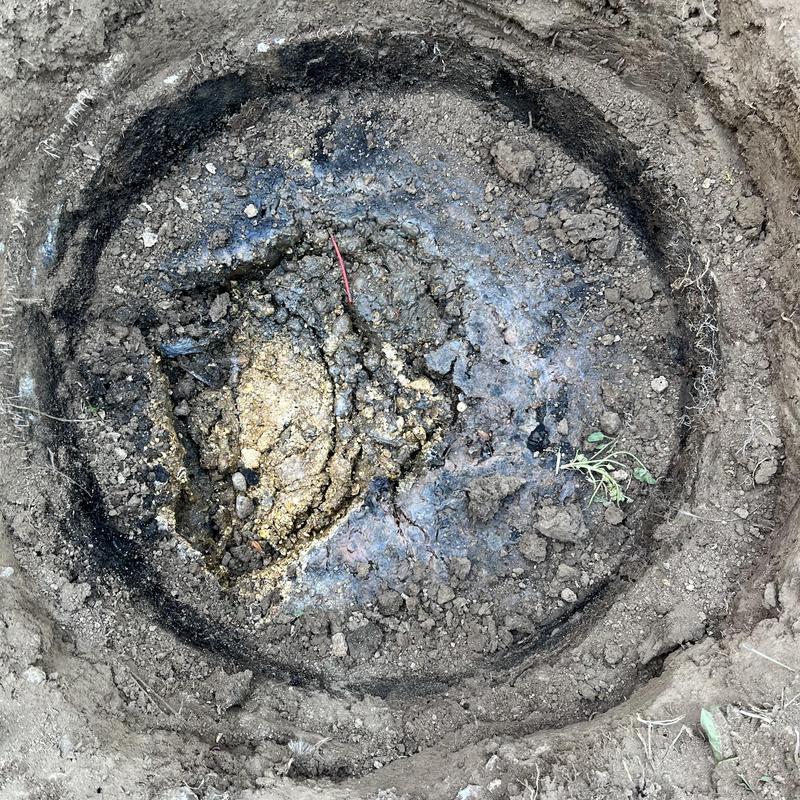 Septic tank crust layer during inspection in soil ground