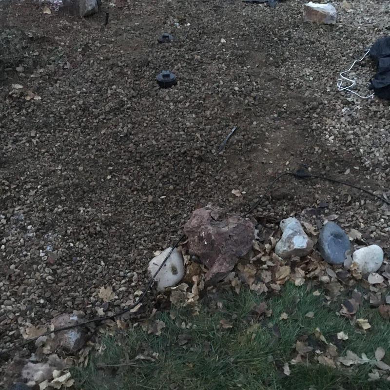 Sewer line excavation with cleanout installation in yard