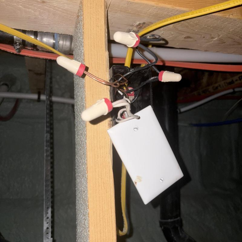 Electrical junction box with exposed wiring in crawl space