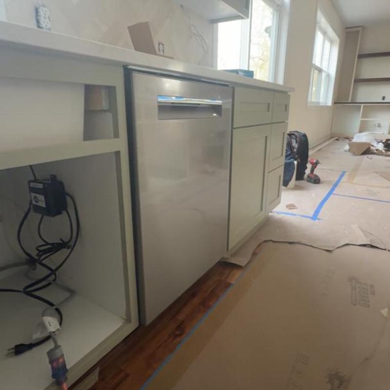 Dishwasher installation in kitchen remodel site