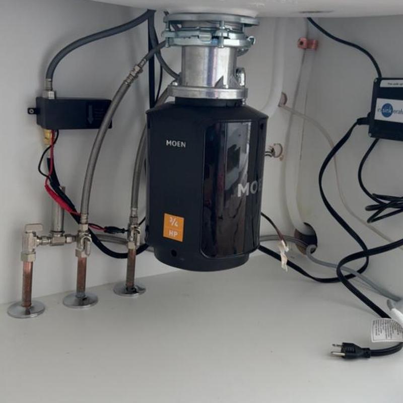 Garbage disposal installation with plumbing connections