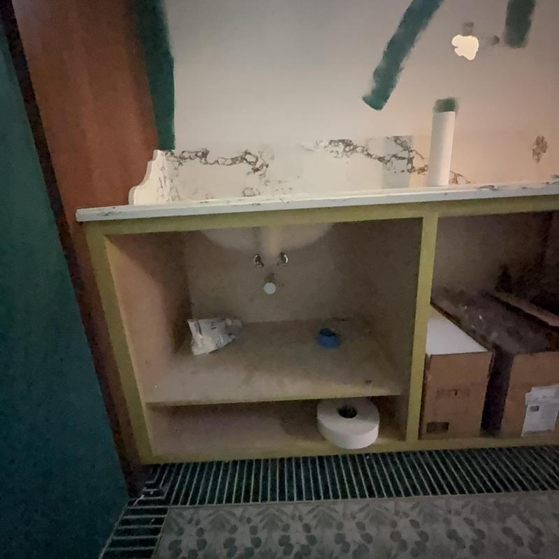 Bathroom sink cabinet with plumbing and countertop installation