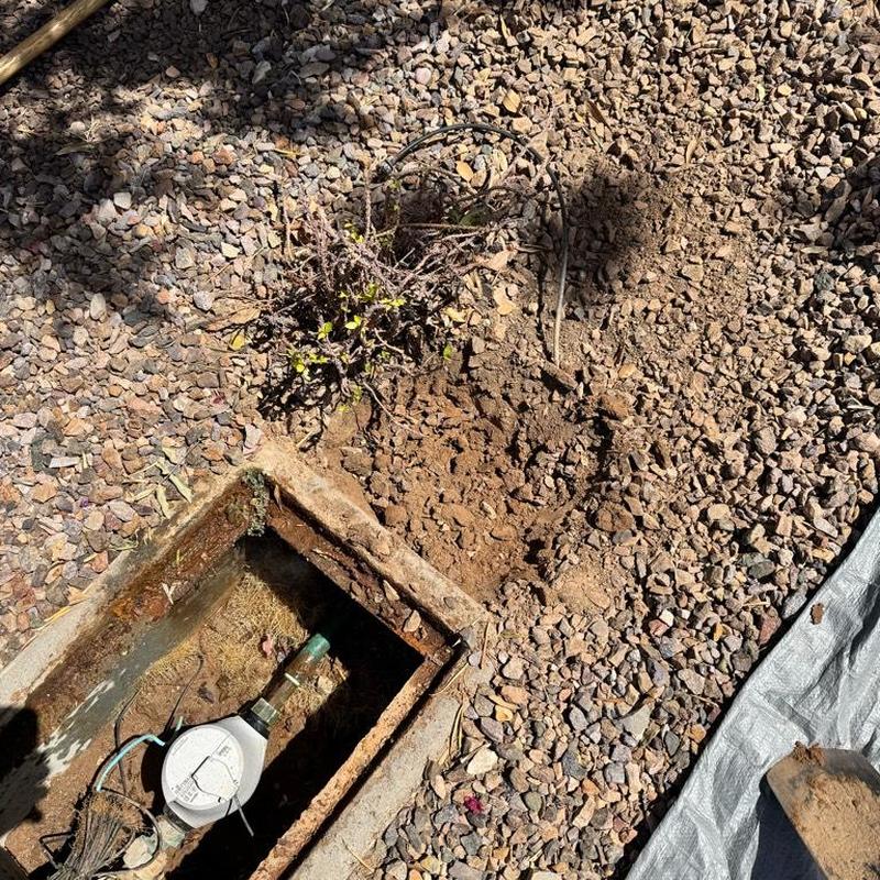 Copper water main near meter with exposed leak repair
