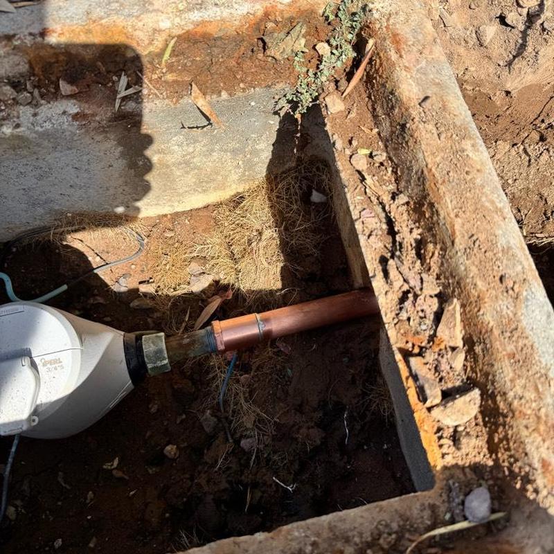 Copper water main pipe repair near meter and backfill