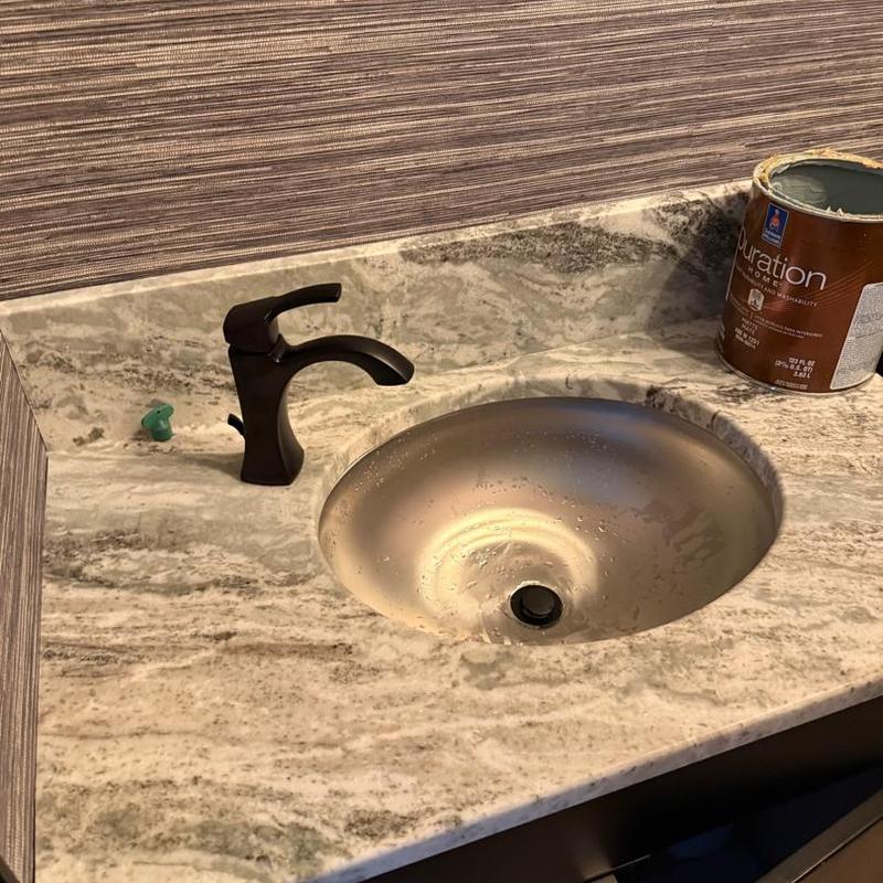 Bathroom sink and faucet with marble countertop installation