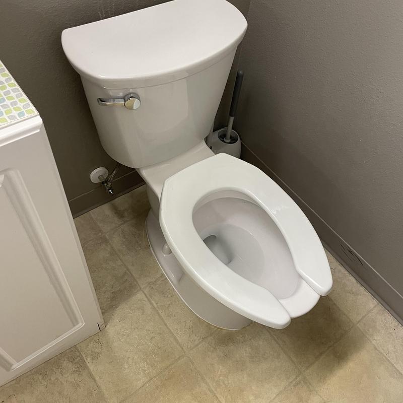American Standard elongated toilet installation in break room