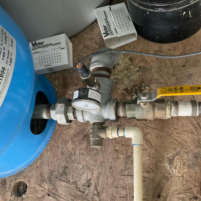 Well pressure relief valve with pressure gauge and piping