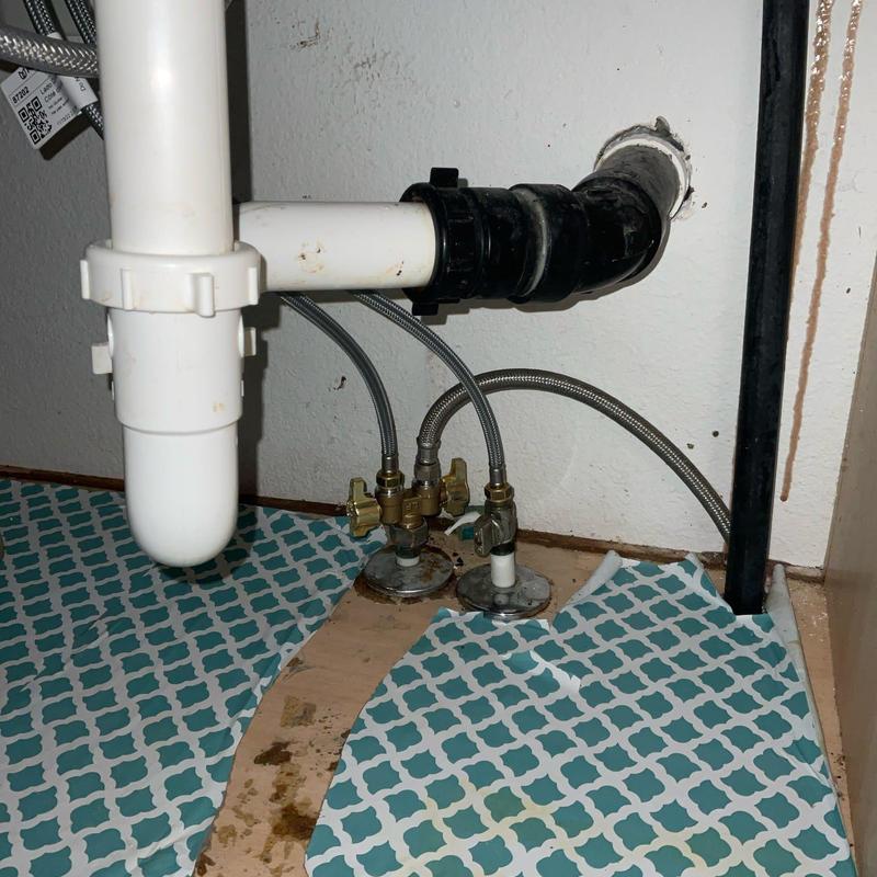Hot water shut-off valve with supply lines under sink