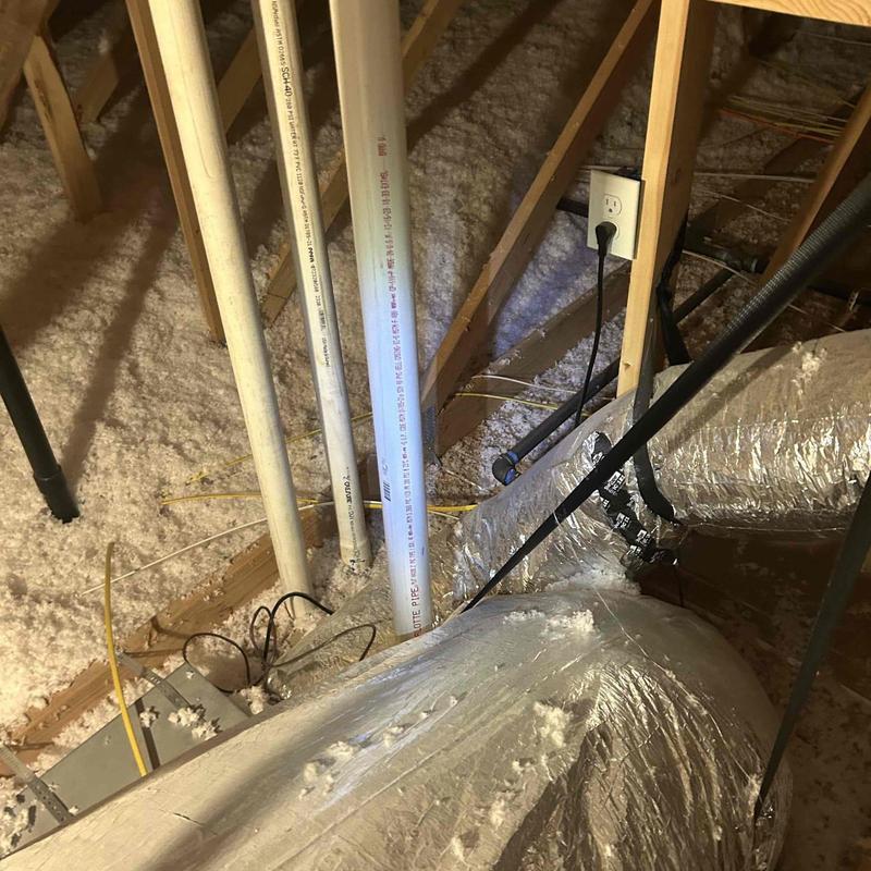 Crawlspace fan inspection with ductwork and piping