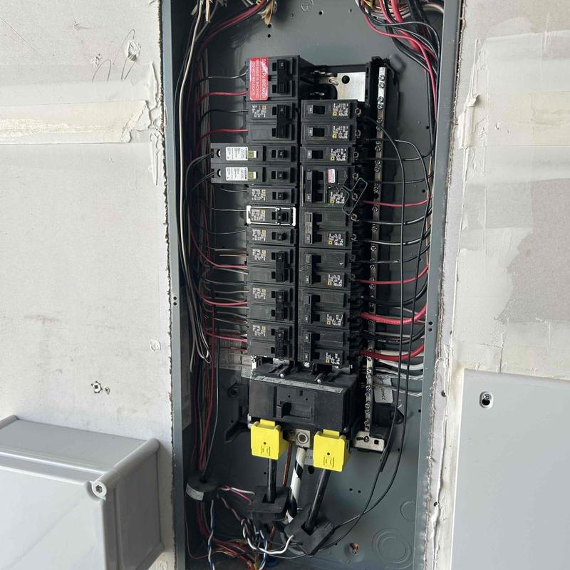 Electrical breaker panel with wiring and switches