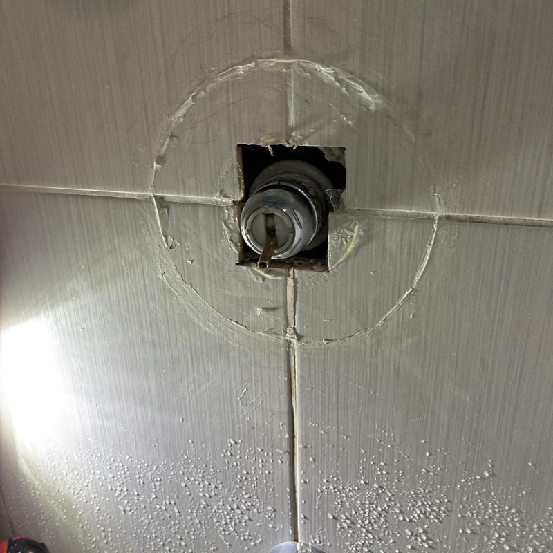 Shower faucet valve with tile cutout for repair