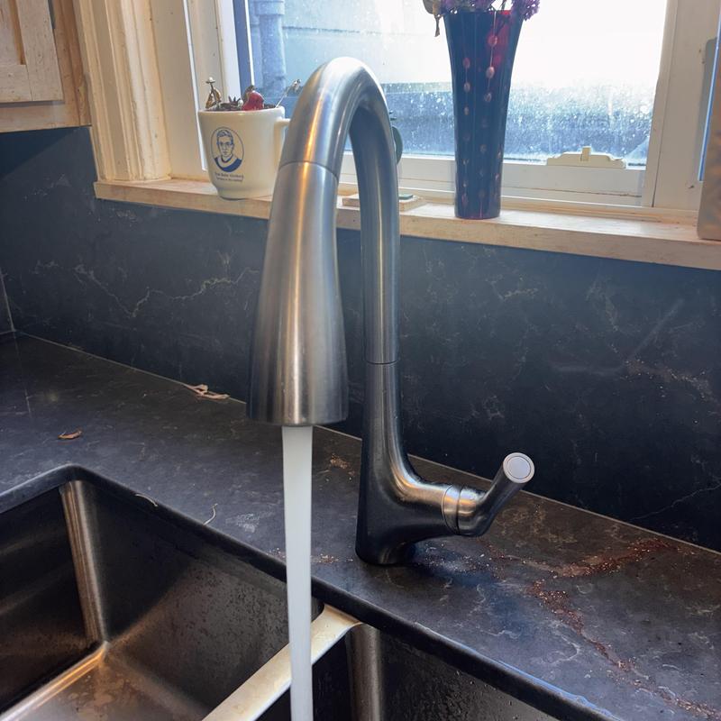 Kitchen faucet with running water in residence