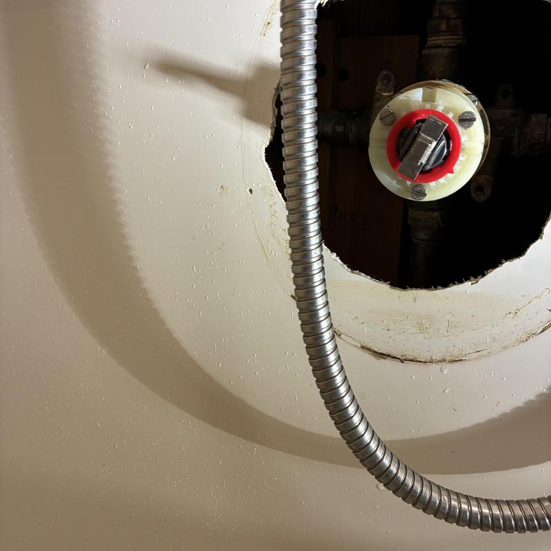 Shower valve pressure balancing unit with plumbing access hole