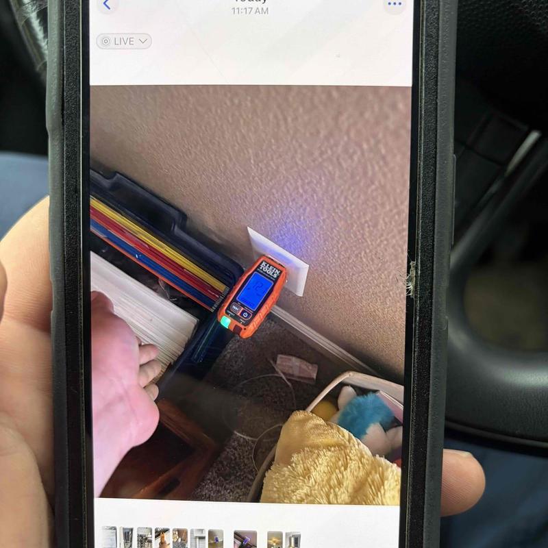 Electrical outlet voltage testing with meter on smartphone screen