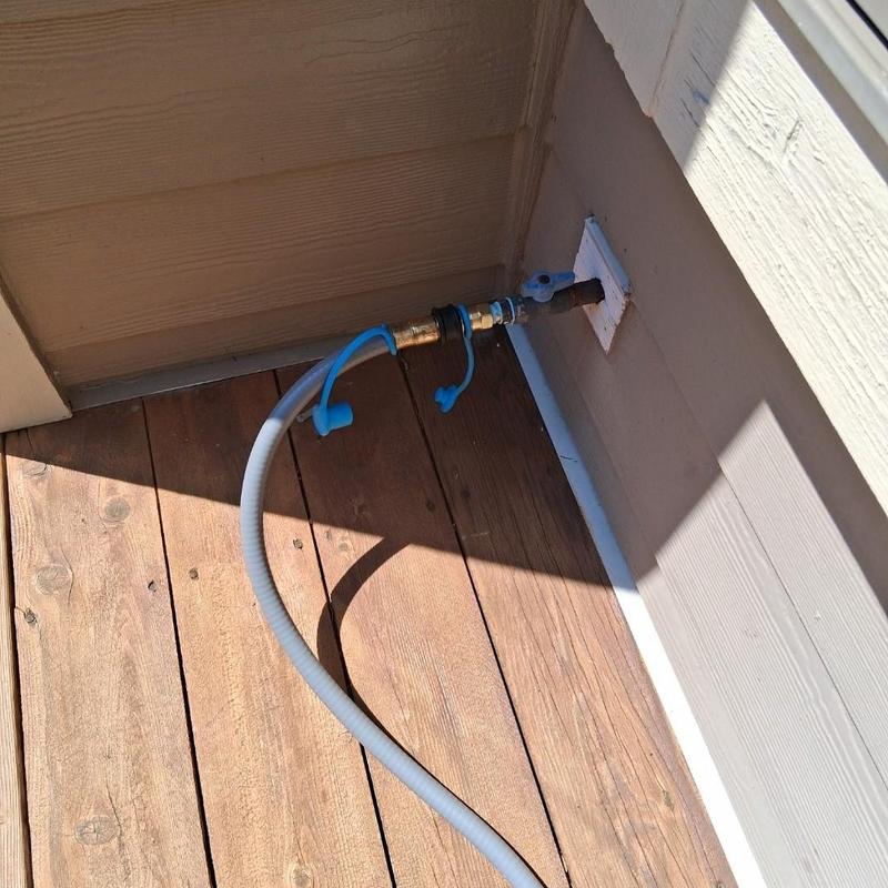 Natural gas grill connection hose on deck