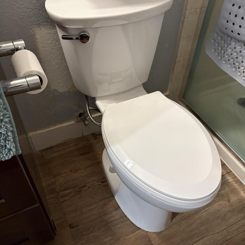 Comfort height elongated toilet with slow close seat installed