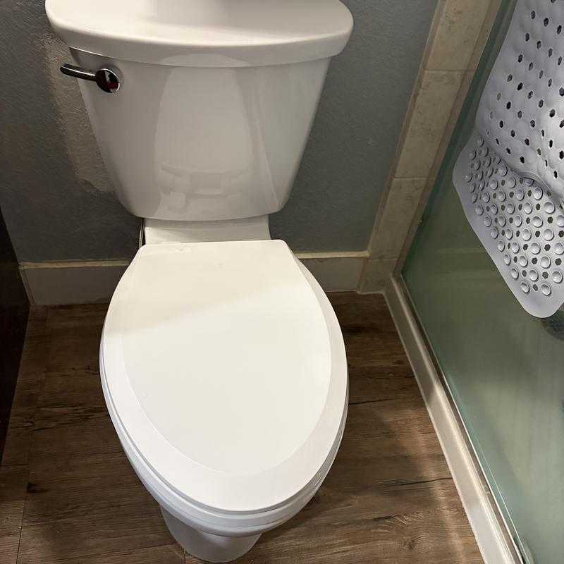 Comfort height elongated toilet with slow-close seat installed