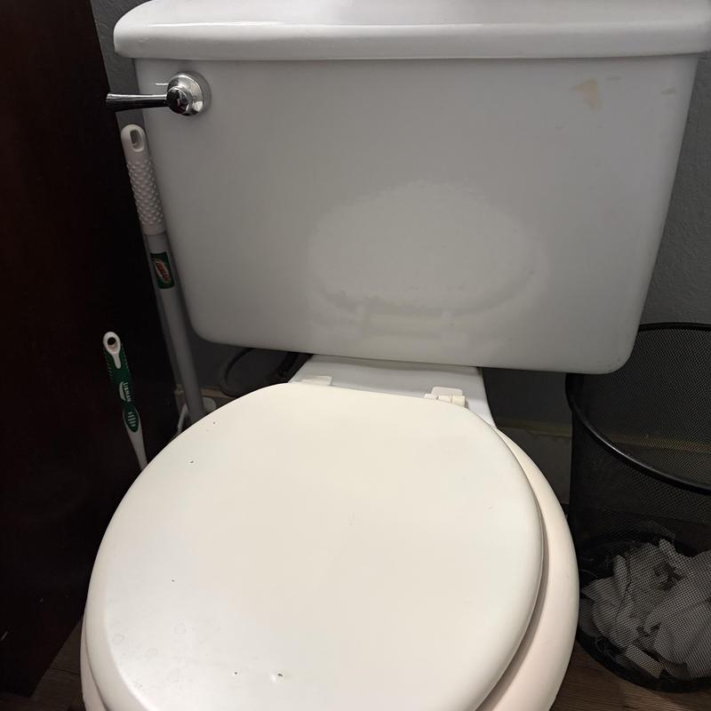 Comfort height elongated toilet with slow-close seat installed