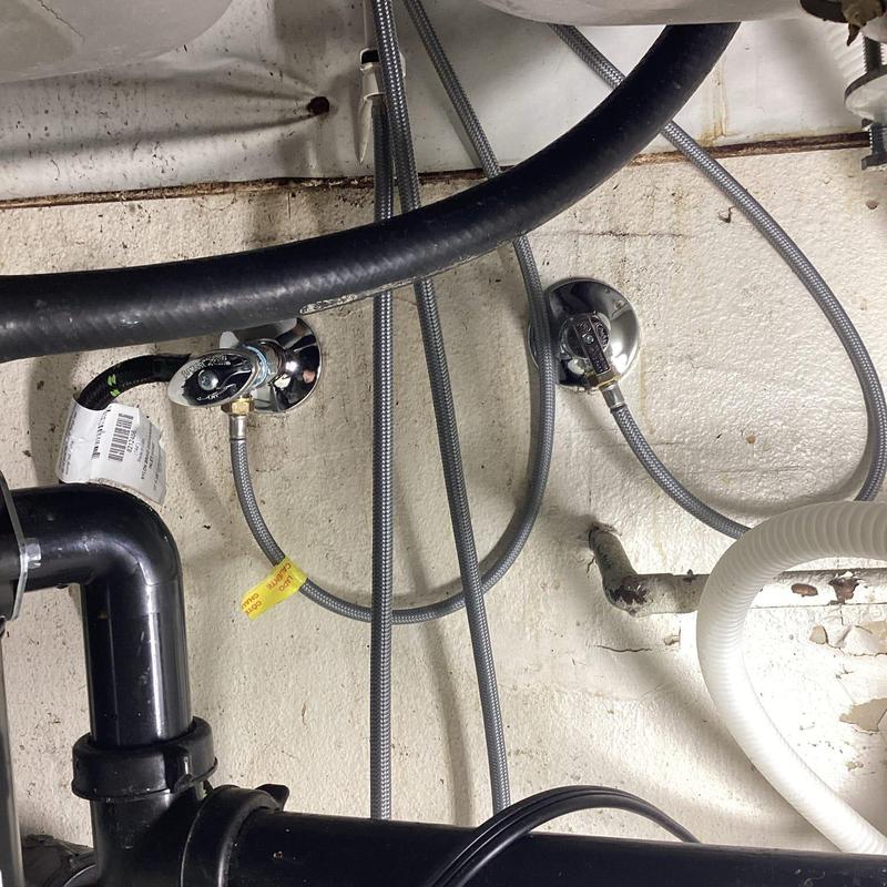Quarter-turn angle stop valves with braided hoses installed