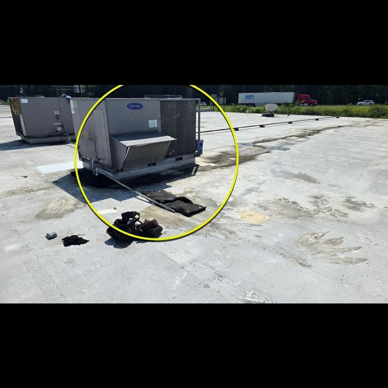 TPO flat roof around rooftop HVAC unit in shopping center TPO flat roof around rooftop HVAC unit in shopping center