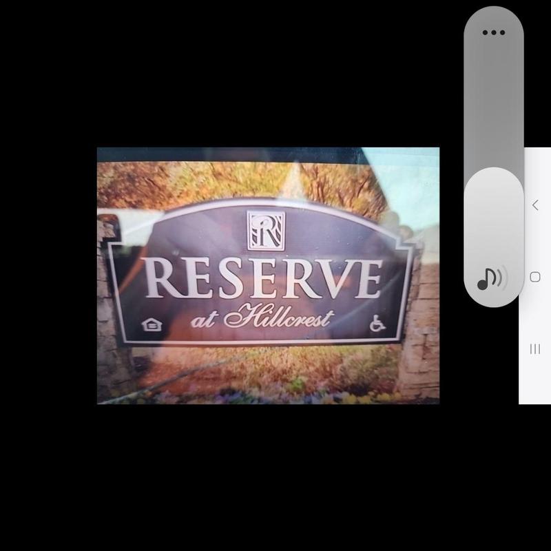 Apartment complex entrance sign for Reserve at Hillcrest Apartment complex entrance sign for Reserve at Hillcrest