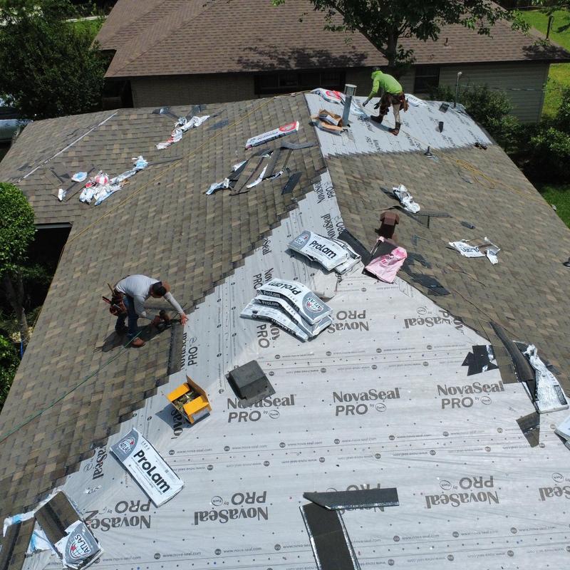 Atlas ProLam shingles installation on residential roof Atlas ProLam shingles installation on residential roof