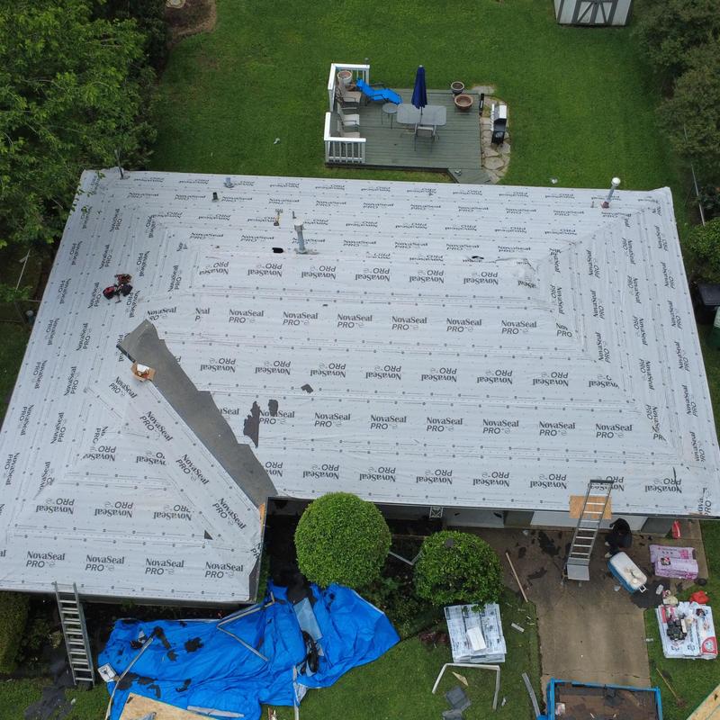 Synthetic underlayment installation on residential roof Synthetic underlayment installation on residential roof