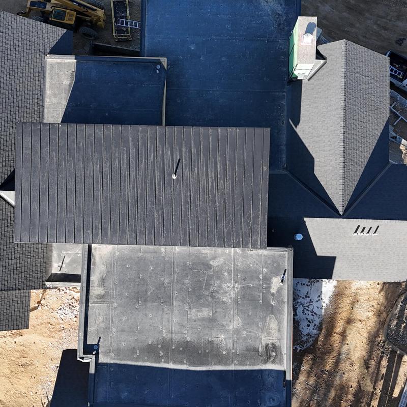 Standing seam metal roof and asphalt shingles installation