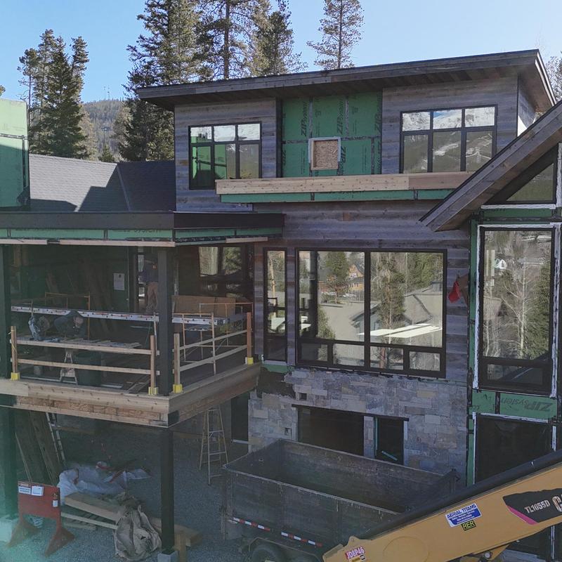 Standing seam metal roof installation on home